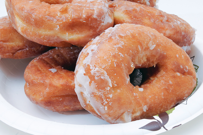 plate of glazed donuts