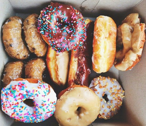 box of a dozen donuts with sprinkles from Golden Donuts & Diner
