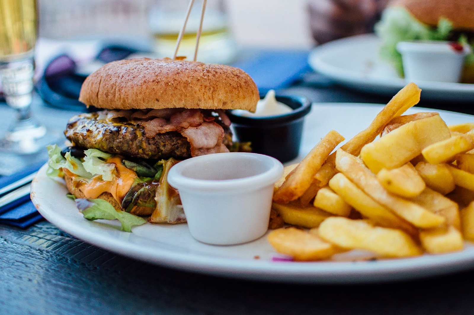 cheeseburgers and fries on a plate from Indian Head Roadhouse