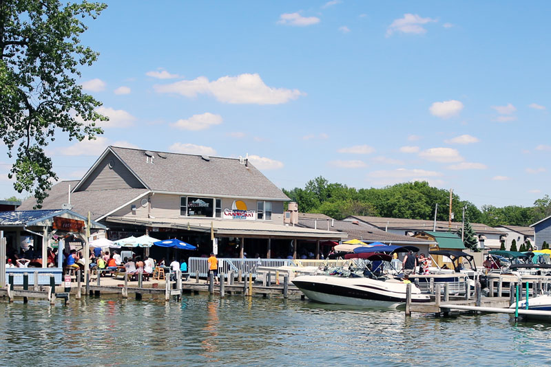 boat at dock in front of Cranberry Resort restaurant