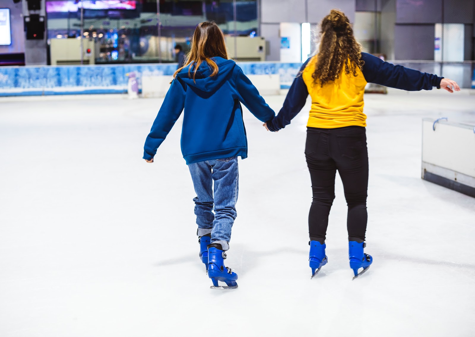 ice skaters in rink skating during open skate