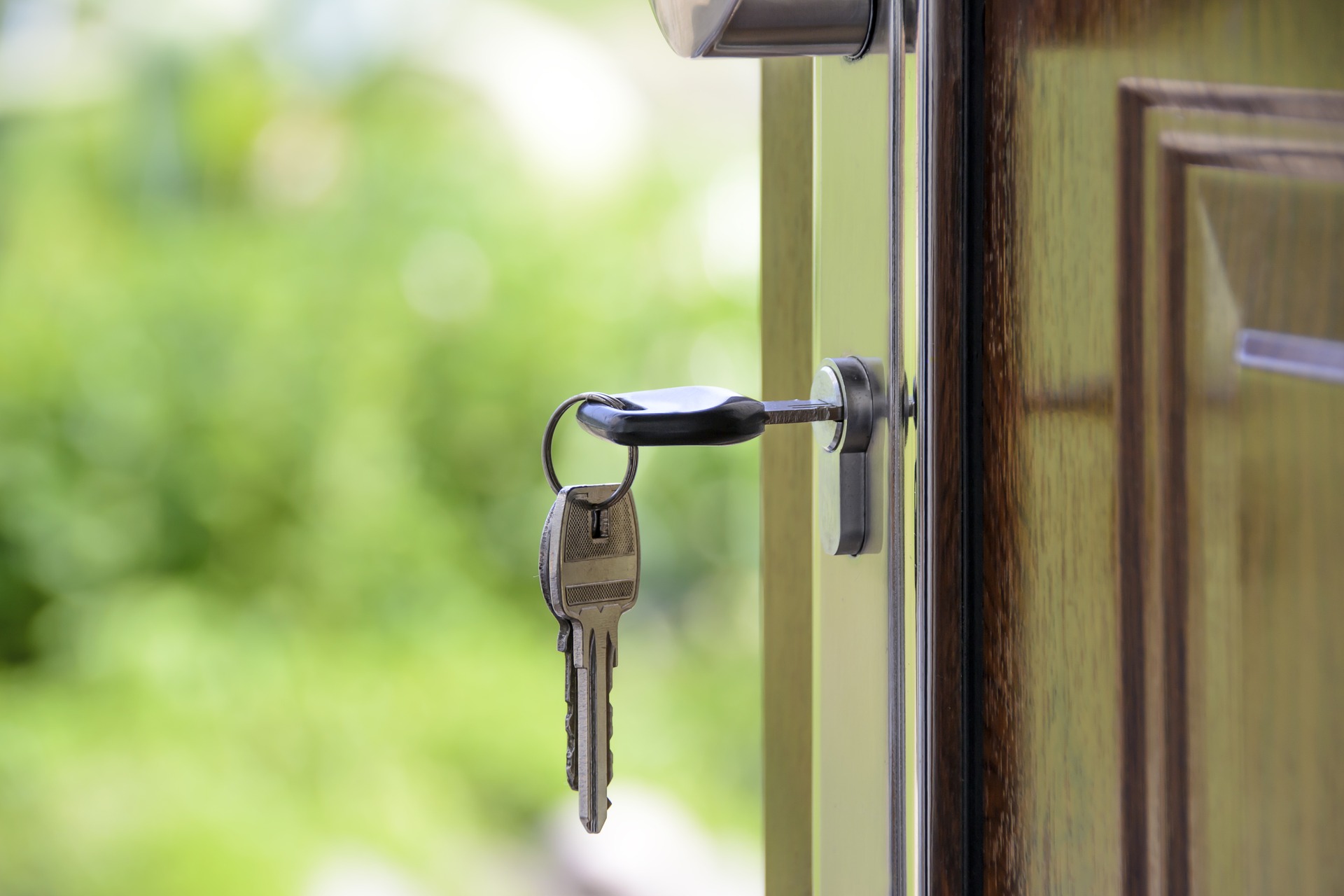 a key in the door of a home