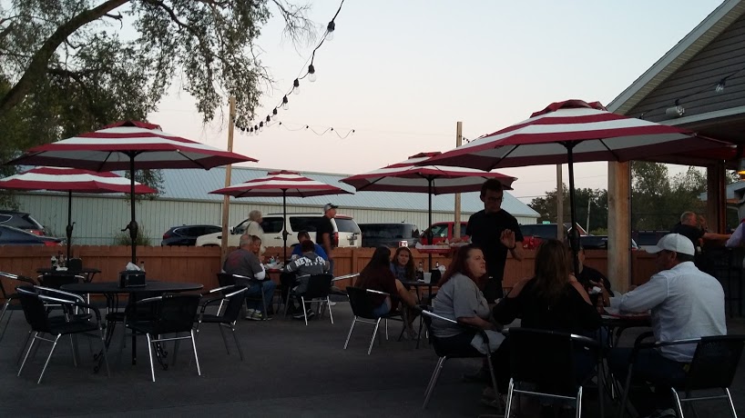 people eating outside at Woody's Diner