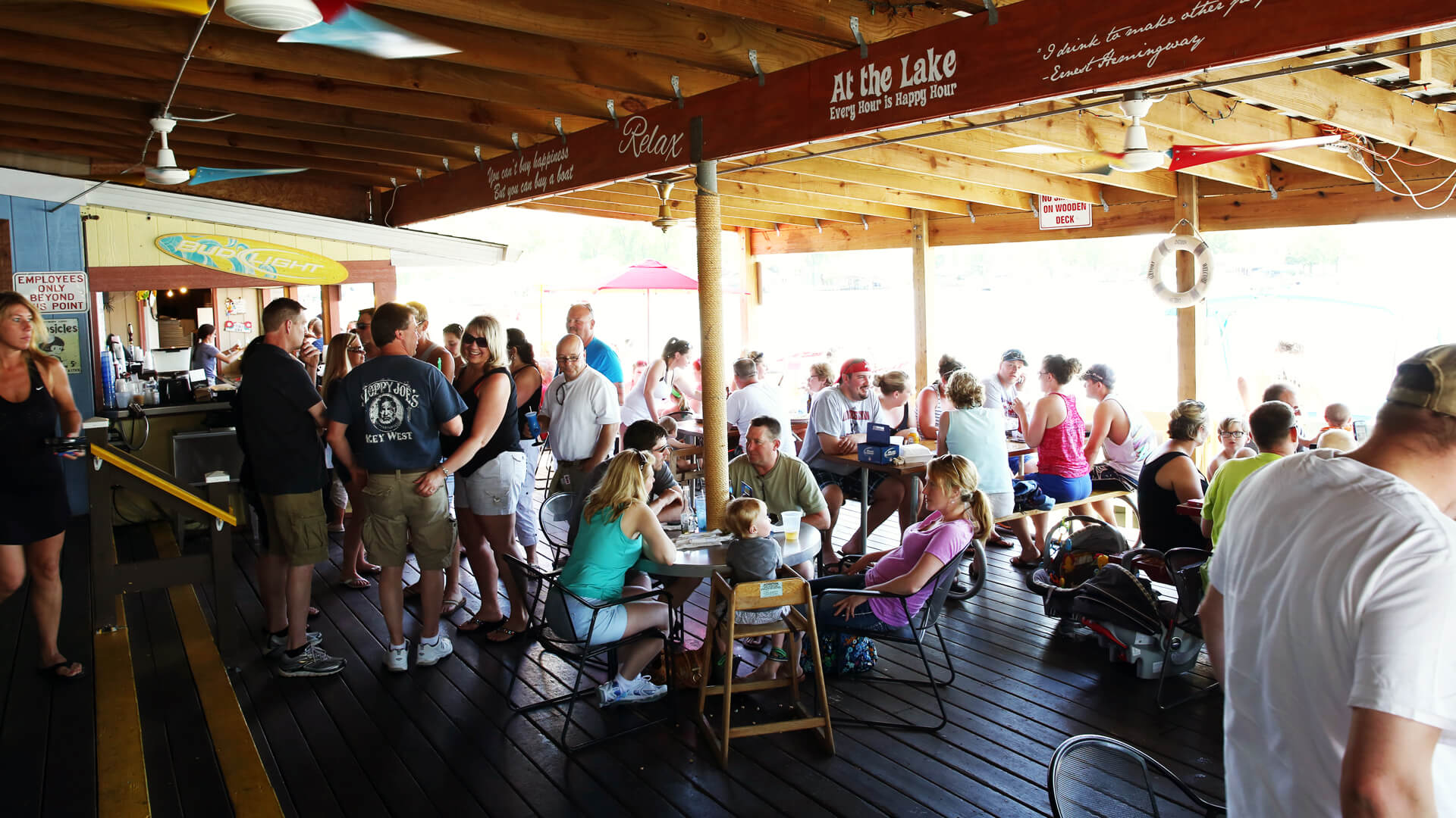 many people eating in Cranberry Resort Waterfront Bar & Restaurant at the lake