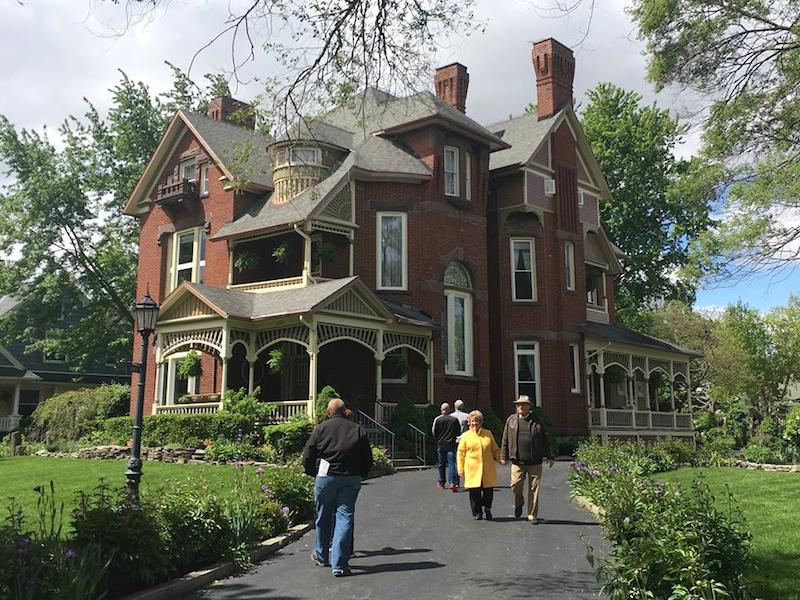 people walking in and out of Little Red Schoolhouse