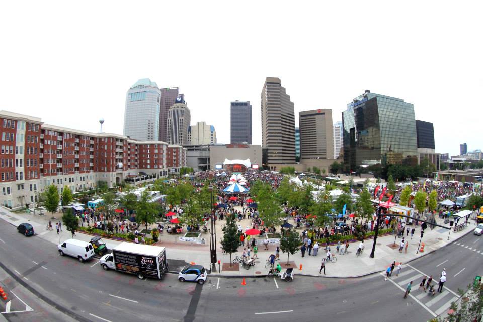 bird's eye view of Columbus food truck festival with buildings in the background