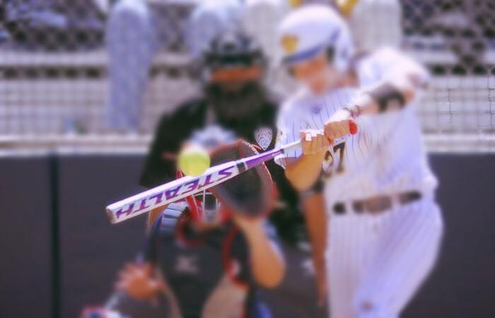 baseball player hits the ball