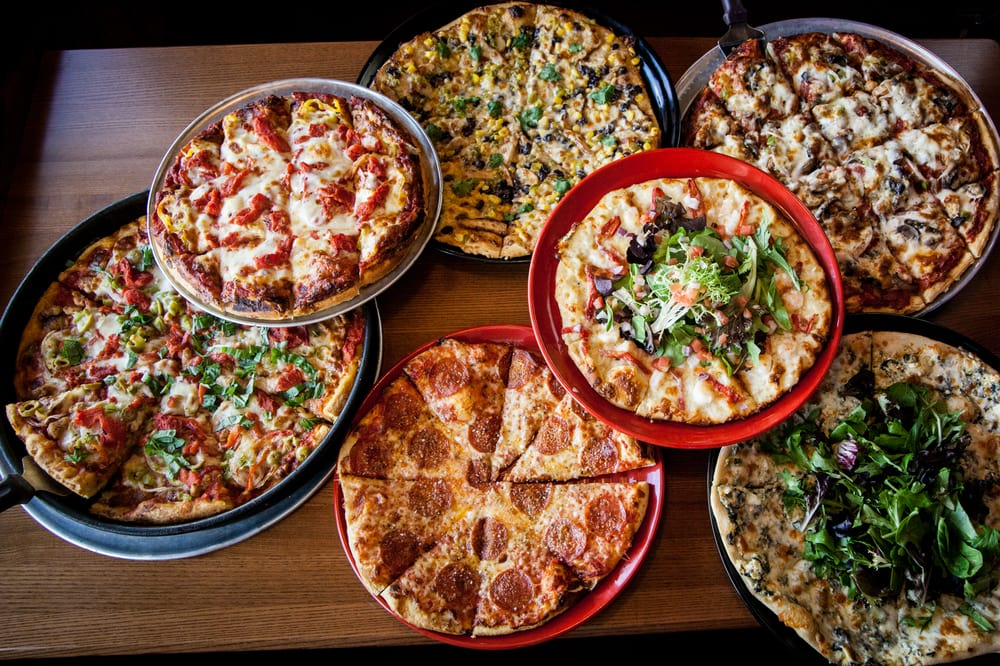 pizzas of different sizes with different toppings