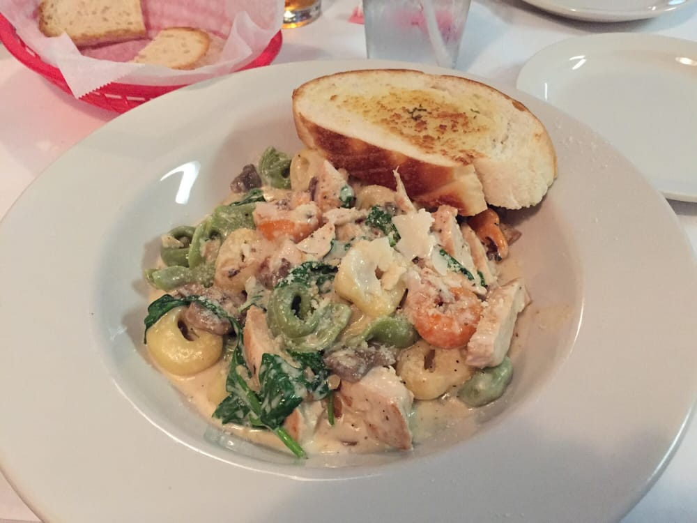 Pasta dish with bread at Omezzo