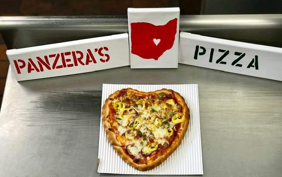 a heart shaped pizza on the counter of panzera's pizza in upper arlington ohio