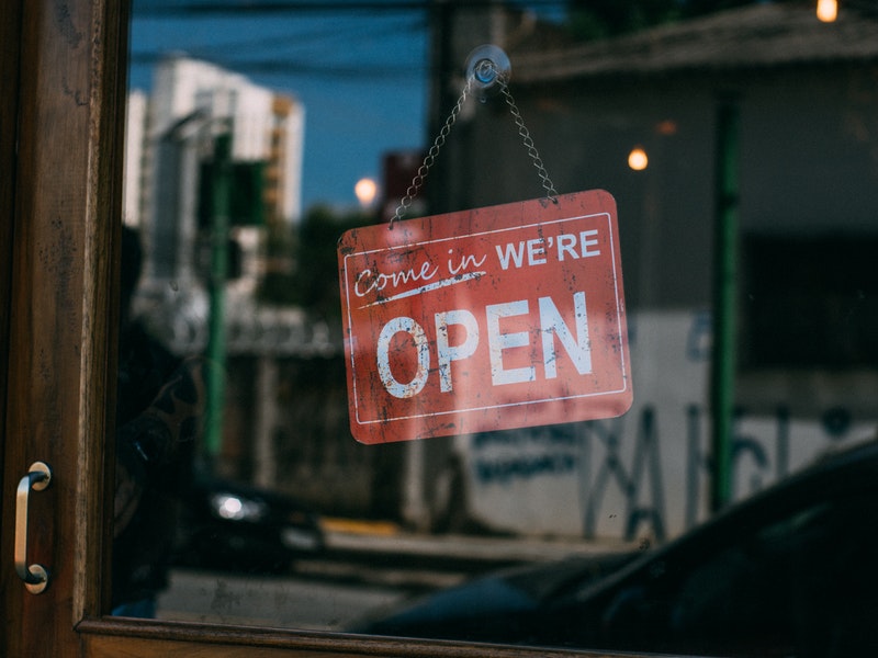 store sign that says open