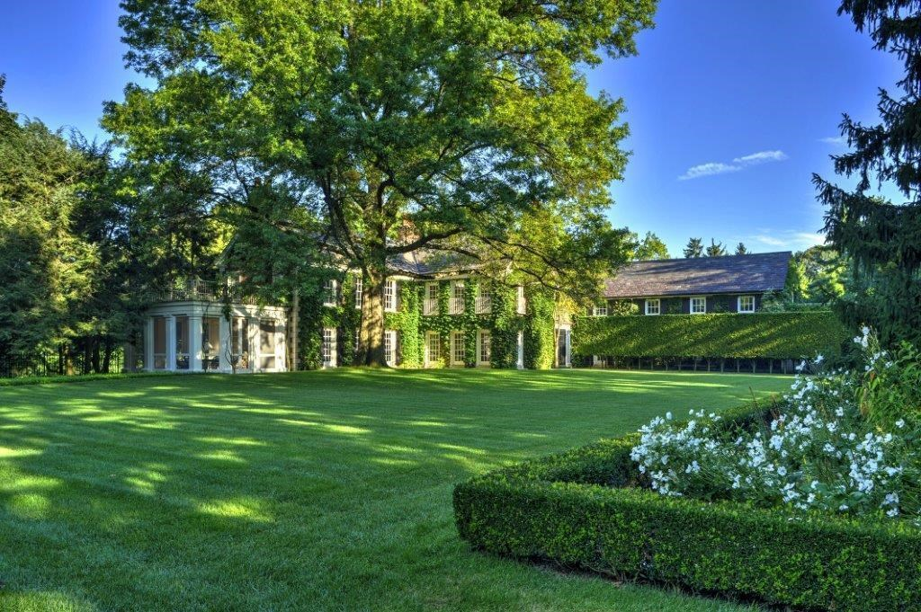 a gorgeous house with a lot of lawn