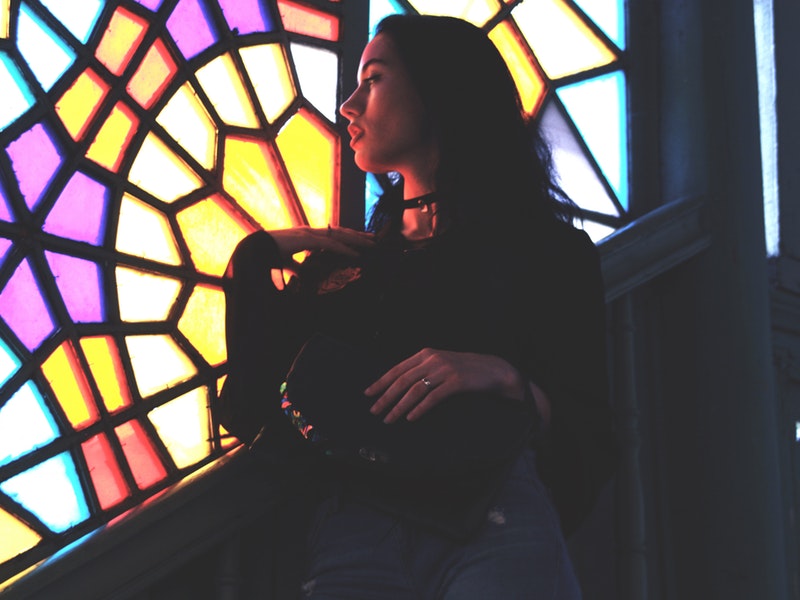 girl looking at stained glass window