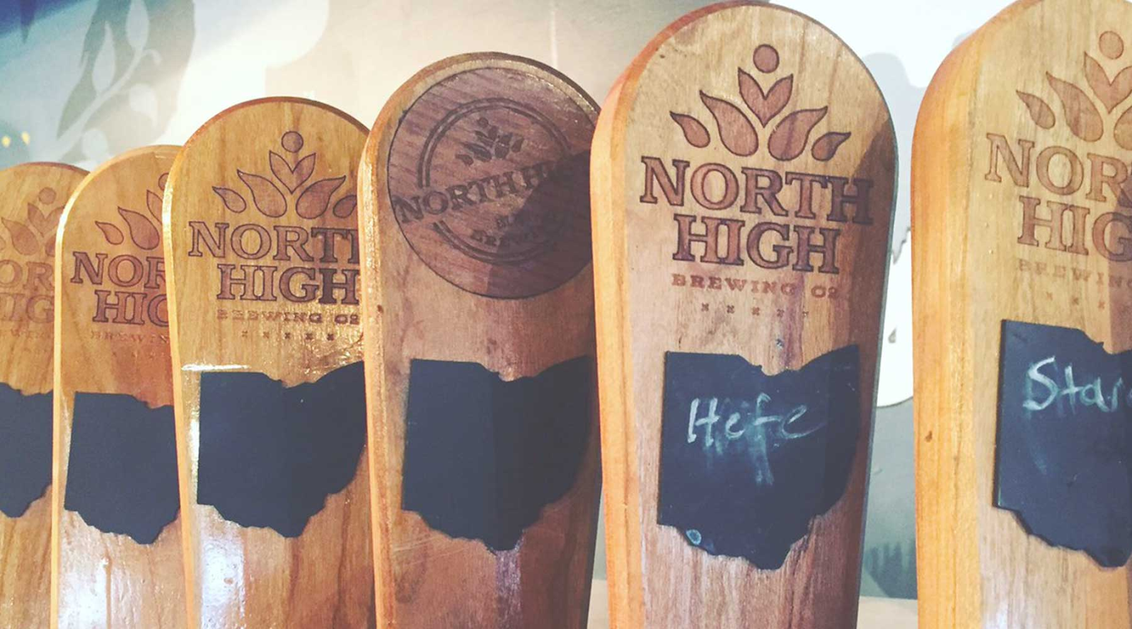 North High Brewing Company branded wooden tap handles