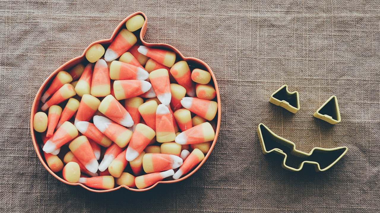 a pumpkin shaped bowl of candy corn