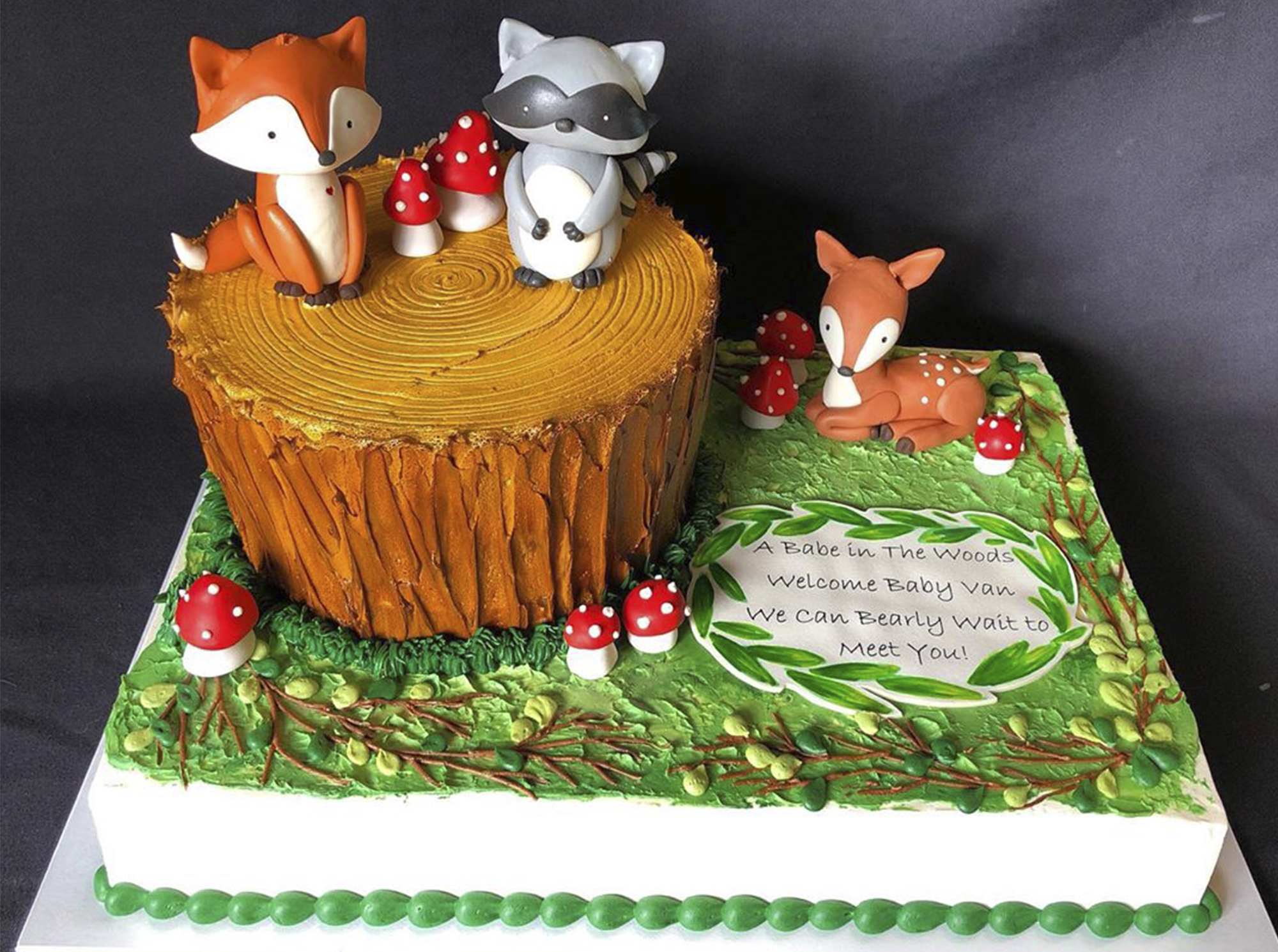 Fancy forst cake with foxes and mushrooms posing on a log