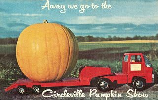 Truck lugging a large pumpkin