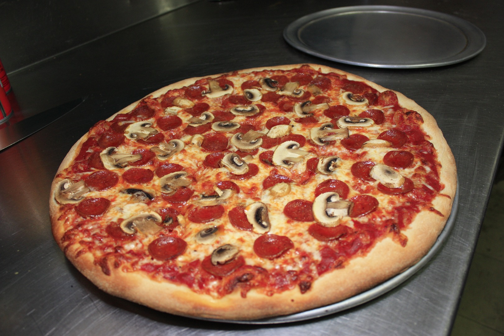 Musroom and pepperoni pizza on in the kitchen