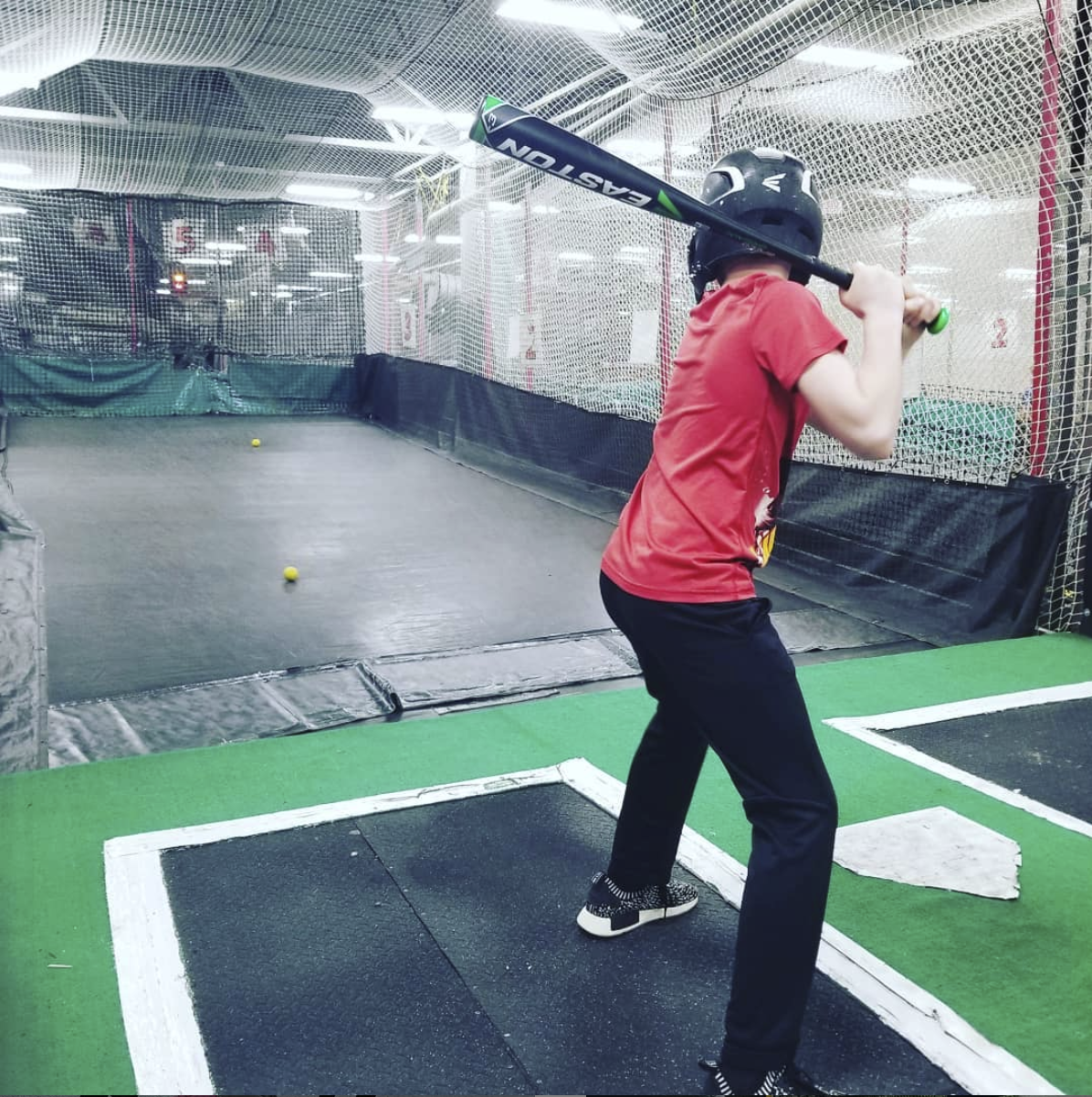 8 year old boy in batting cage
