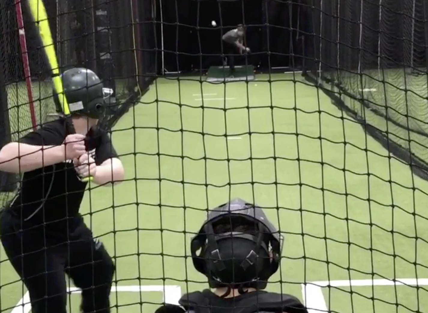 Pre-eten ready to swing in batting cage