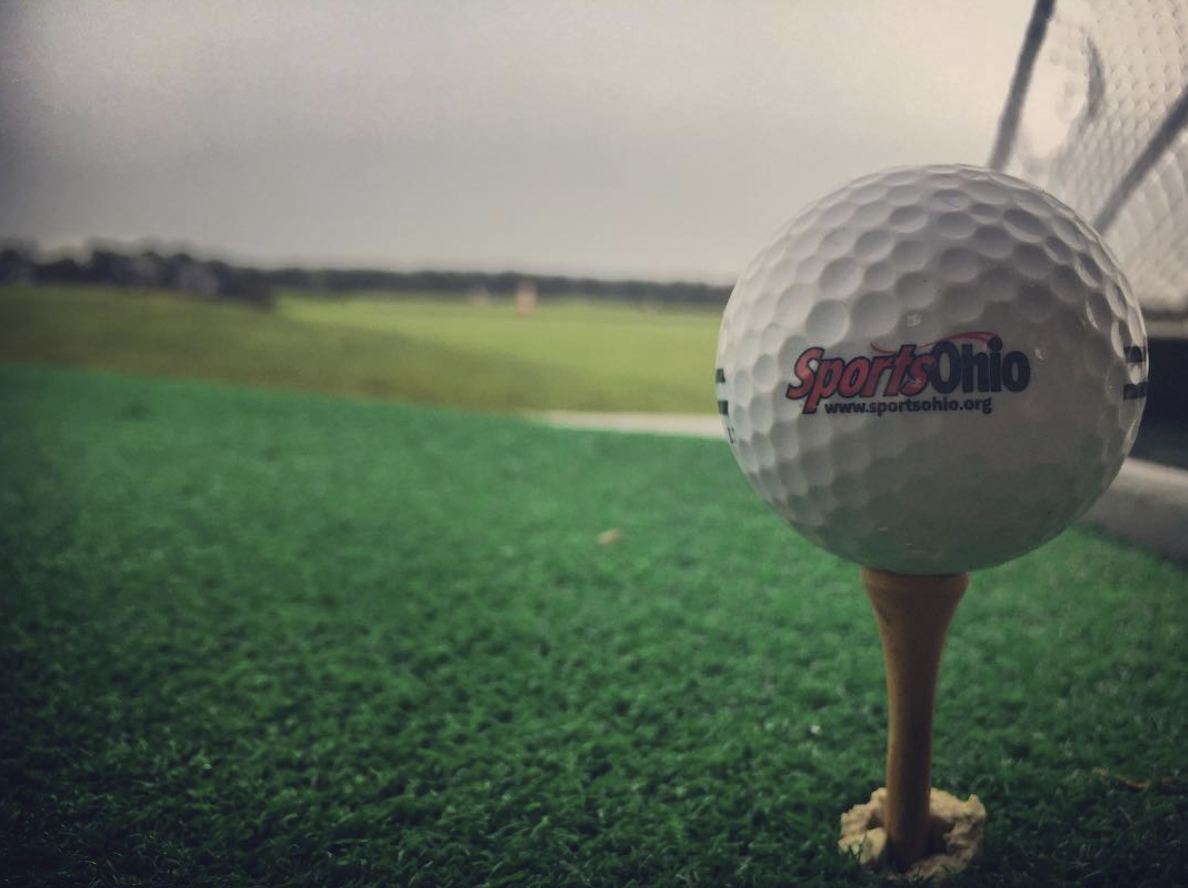Golf ball ready to be hit on tee