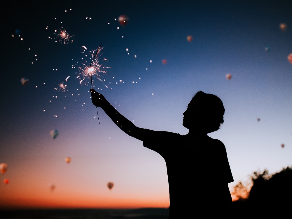 a child holding a sparkler