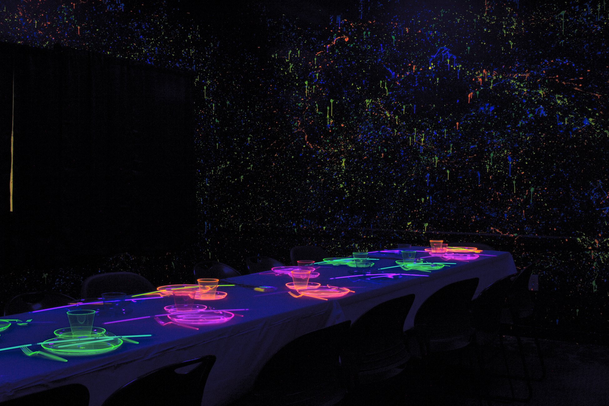 A black lit dining hall 