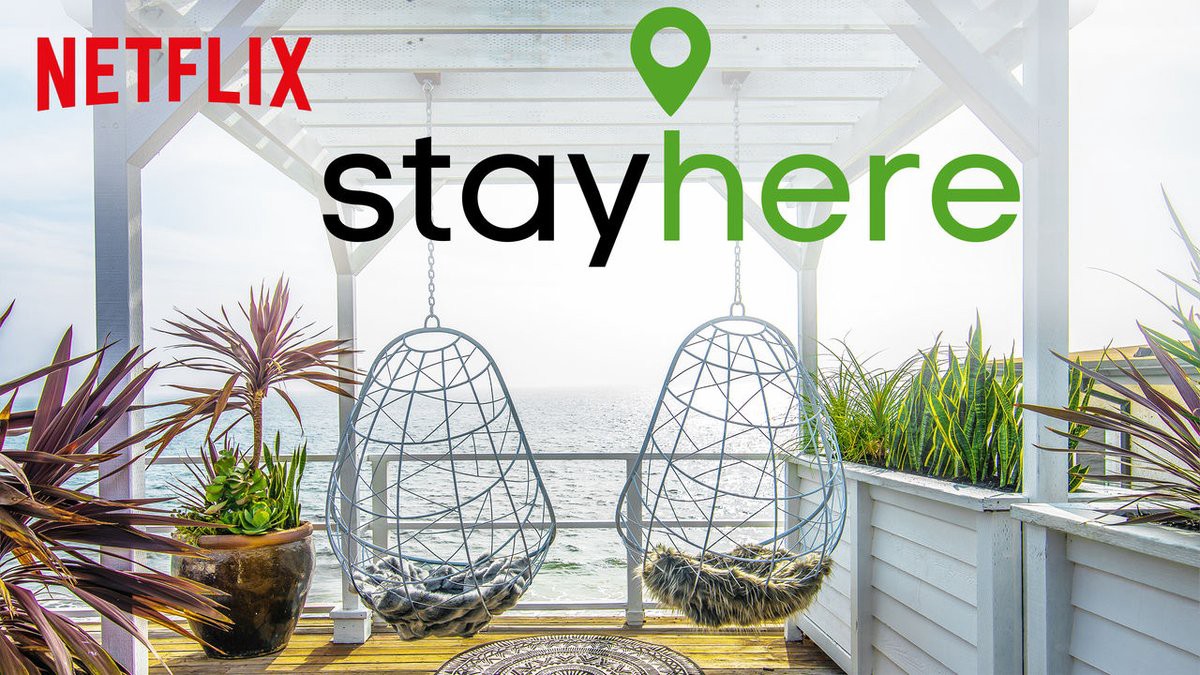 Image of two hanging chairs overlooking an ocean from Netflix Show "Stay Here" 