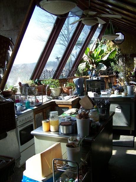 A view from the interior of the house over the lawn