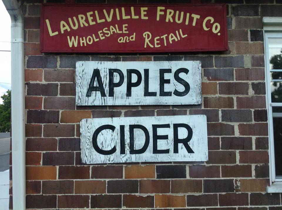 Exterior signs for Laurelville Fruit Co. say they have both apples and cider