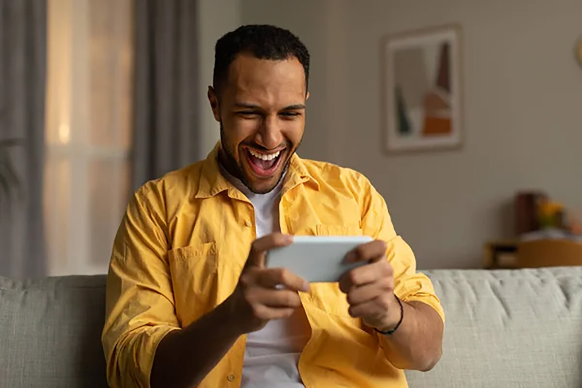 A Man happy holding his phone