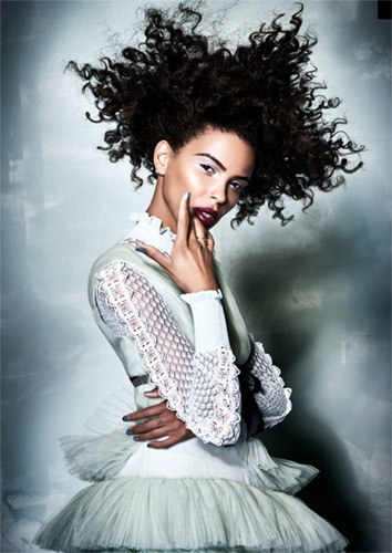 Model from Rick Robert's Afro Hairdresser of the year winning collection. Wearing curly hair and ice blue dress