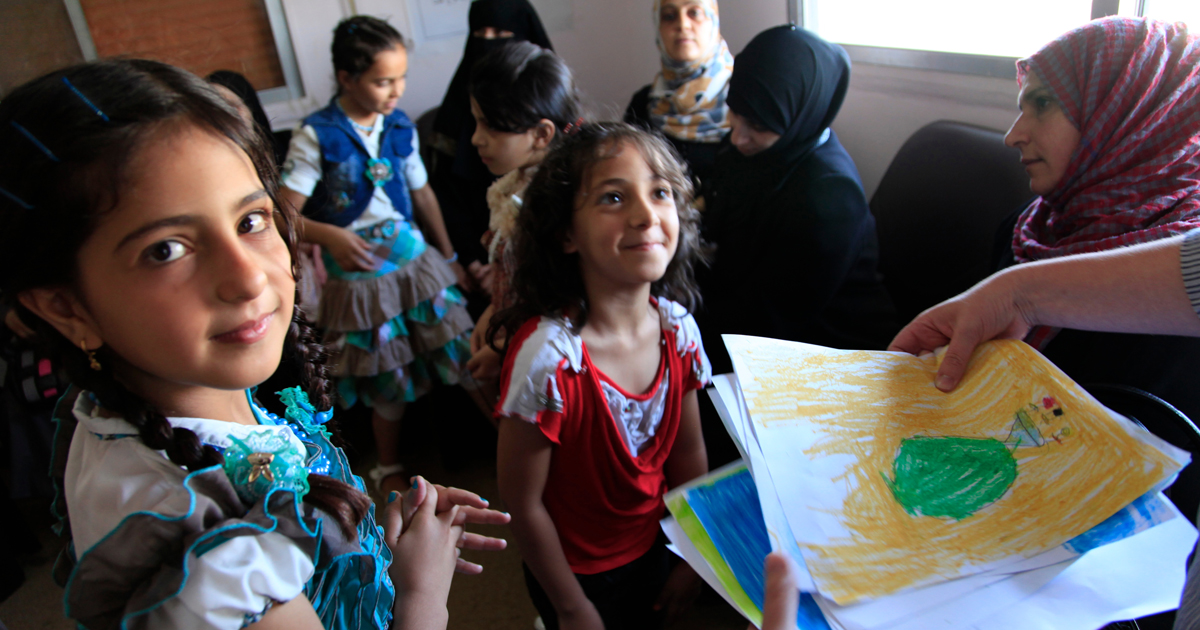 Refugee children from Syria at a clinic in Ramtha, northern Jordan. Photo by Russell Watkins/DFID, licensed under (CC BY 2.0).