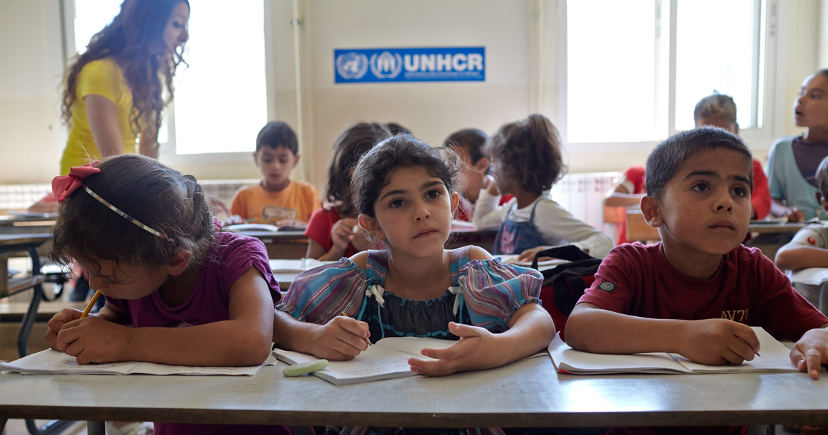 Syrian refugee students attend a class in an accelerated learning program at public school in Kamed Al Louz in the Bekaa Valley, Lebanon. Photo by Shawn Baldwin/UNHCR, licensed under (CC BY-NC 2.0).