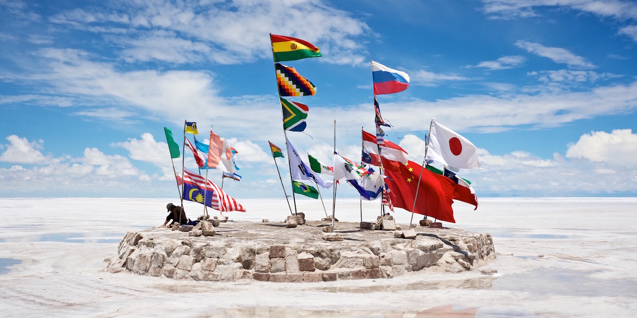 Country flags fly at the Salar de Uyuni salt flats in Bolivia. Photo by Nico Kaiser via Flickr, licensed under (CC BY 2.0).