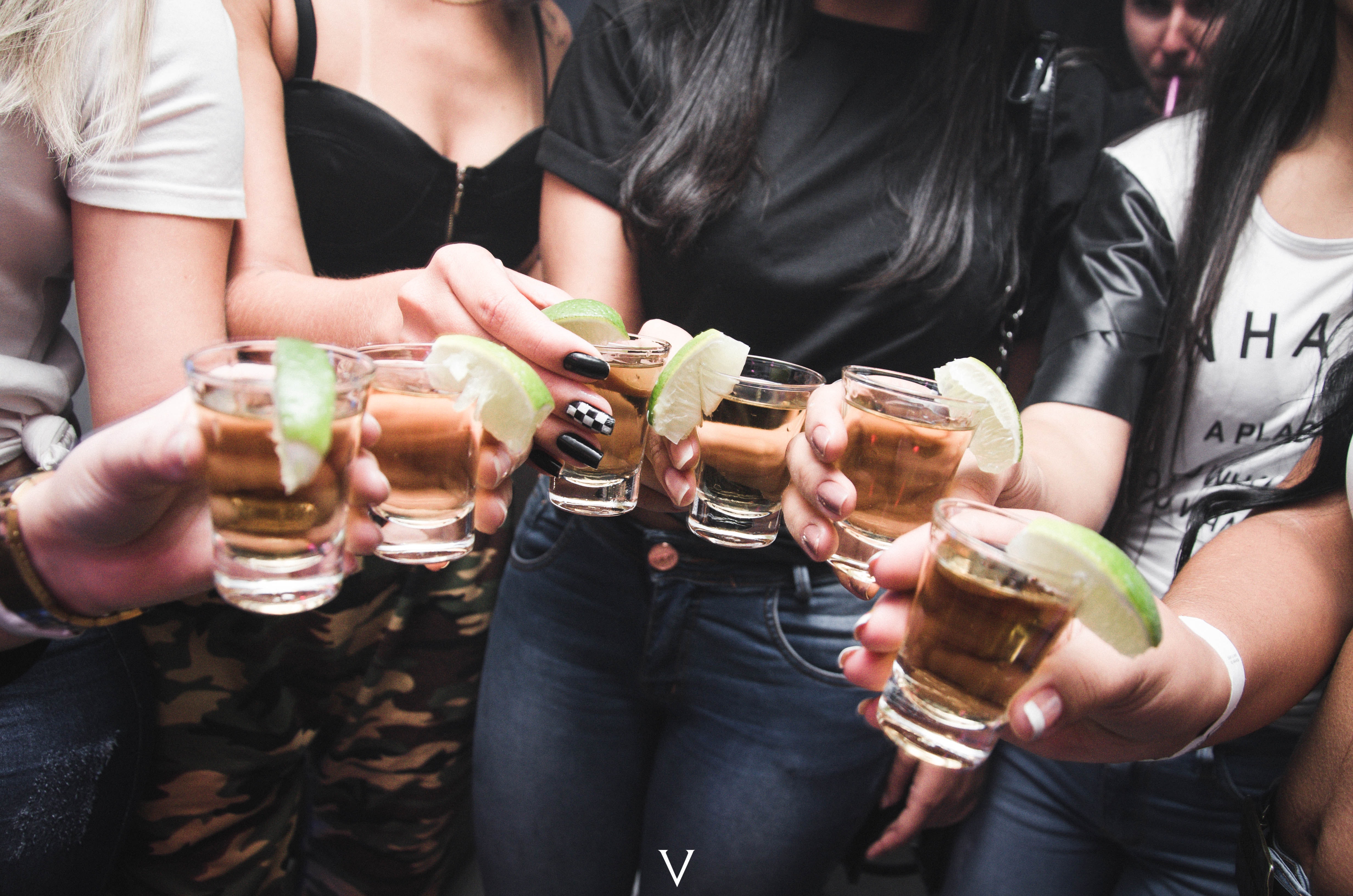 friends holding shot glasses
