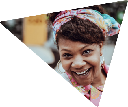 A woman with big earings smiling 