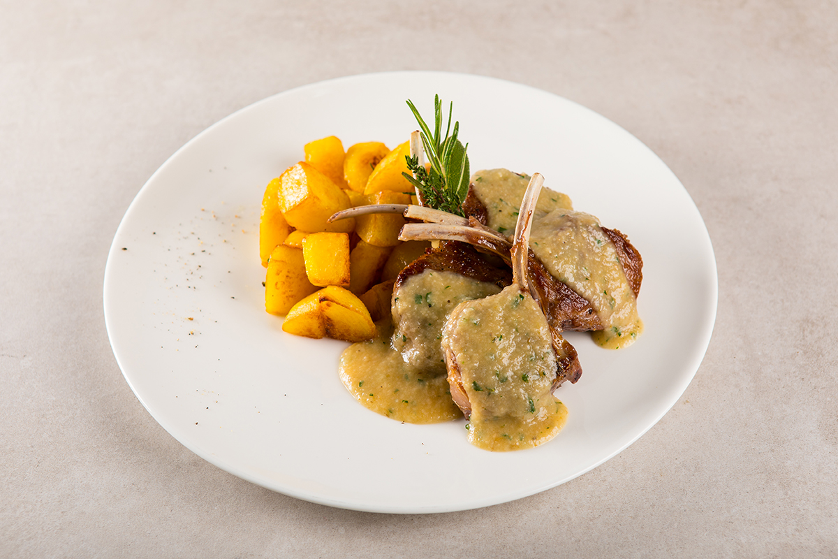 Rack of Lamb on a Anchovies Bread Sauce served with Roasted Potatoes