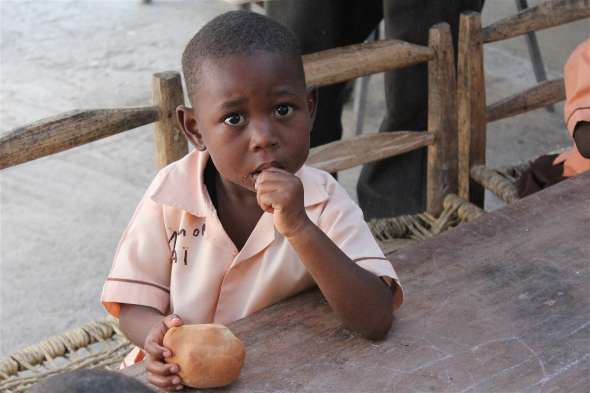Charity for NPH Italia Onlus - Distribution of Bread in Haiti