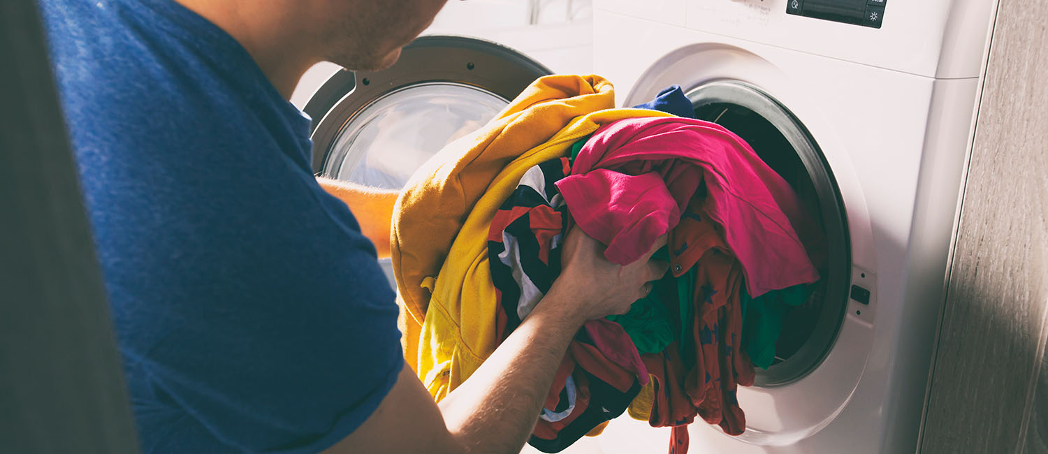 A washer dryer combo being loaded