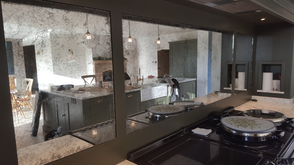 Vintage Antiqued Mirror Kitchen splashback panels behind Aga Saligo
