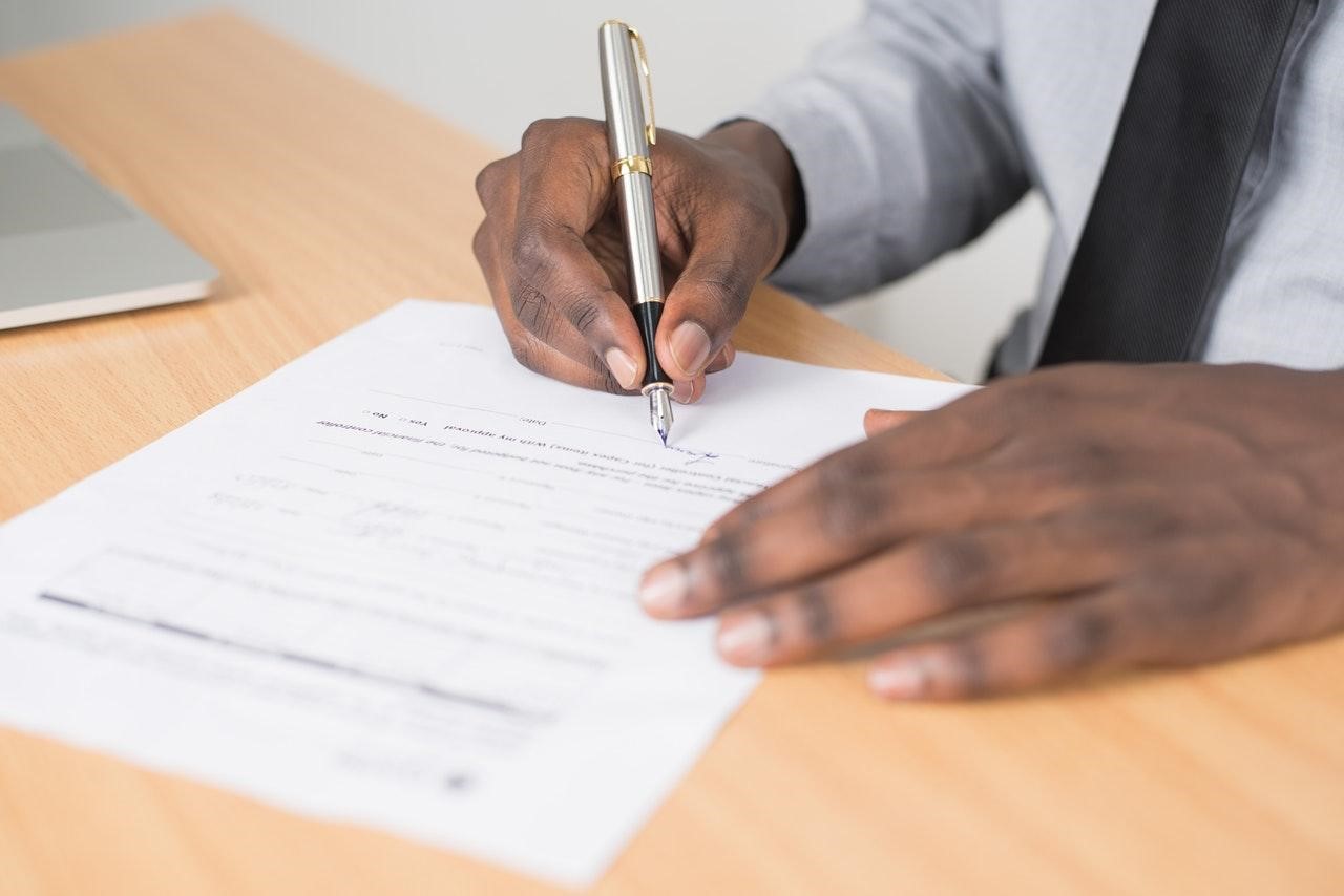 Person signing a business document