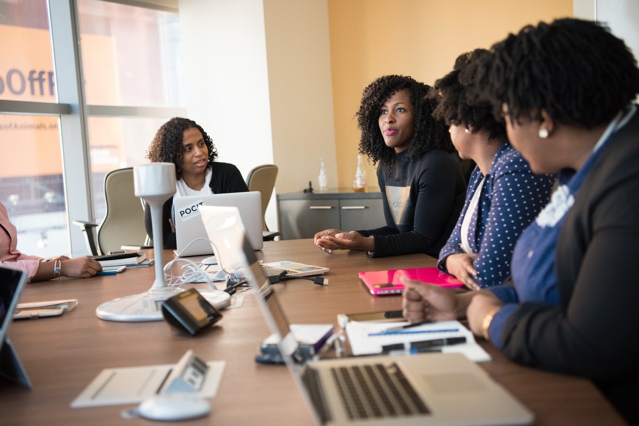 Marketing team sitting around a table discussing