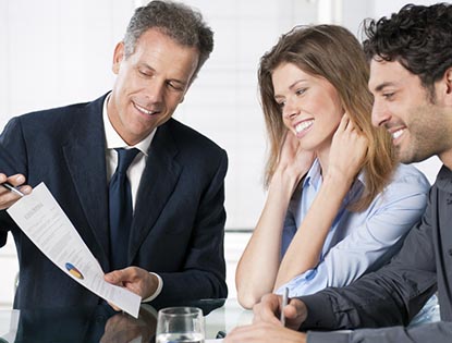 financial advisor in meeting with clients