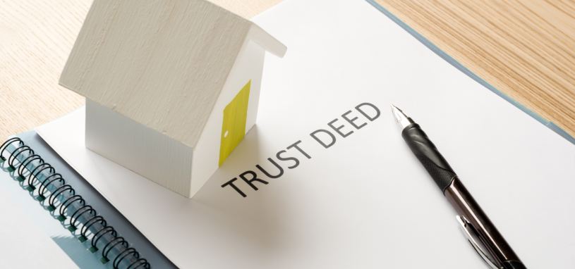 a trust deed on a table