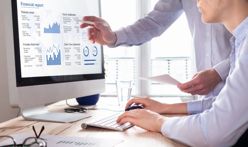 accountants working on financial accounts using accounting software