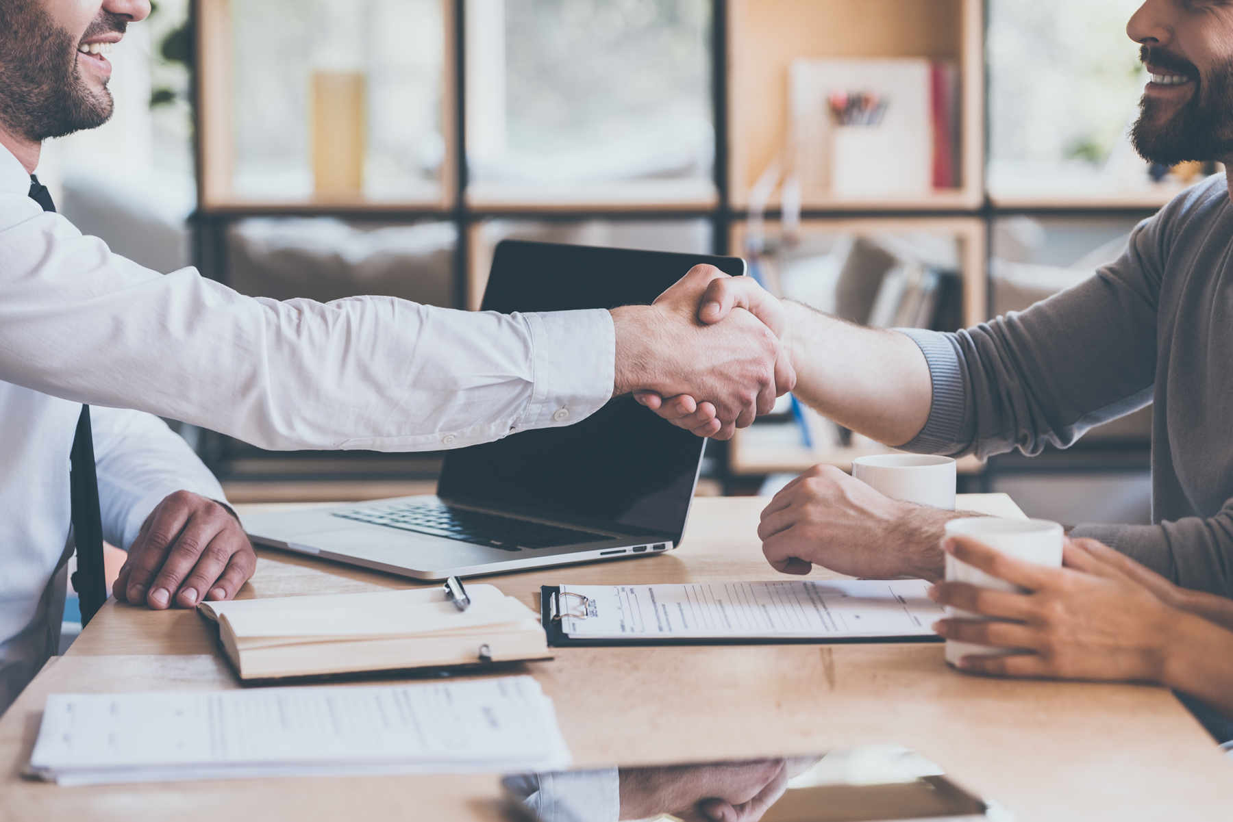 two men completely the sale of a business