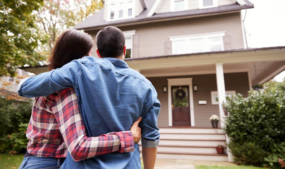 Couple looking at house