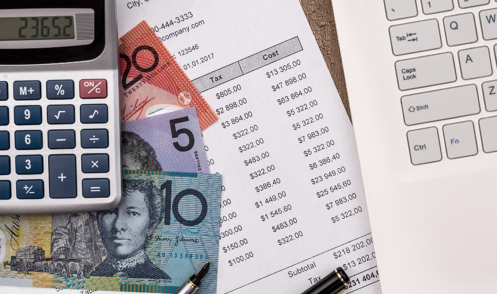 Australian money under a calculator