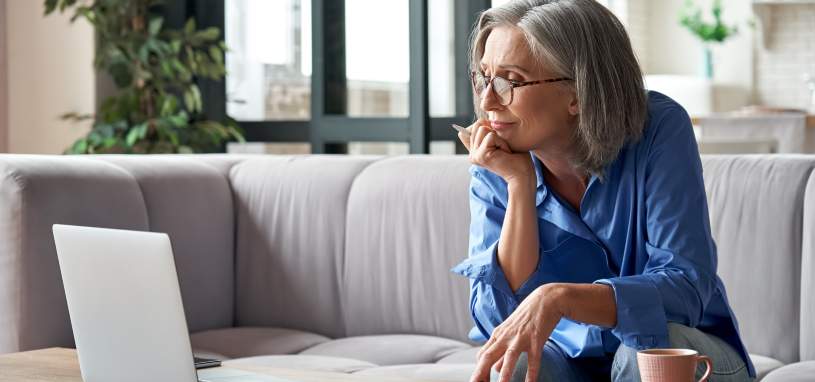 Middle aged woman looking at investment options